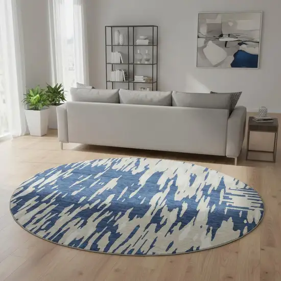 8' Navy Blue And Ivory Abstract Washable Round Rug With UV Protection Photo 2