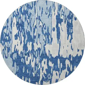 Photo of 8' Navy Blue And Ivory Abstract Washable Round Rug With UV Protection