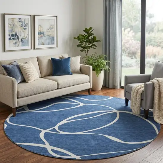 8' Navy Blue And Ivory Abstract Washable Round Rug With UV Protection Photo 1