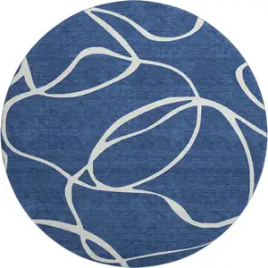 Photo of 8' Navy Blue And Ivory Abstract Washable Round Rug With UV Protection