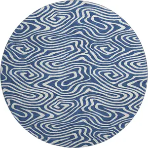 Photo of 8' Navy Blue And Ivory Abstract Washable Round Rug With UV Protection