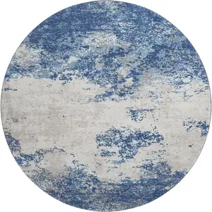 Photo of 8' Navy Blue And Ivory Abstract Washable Round Rug With UV Protection