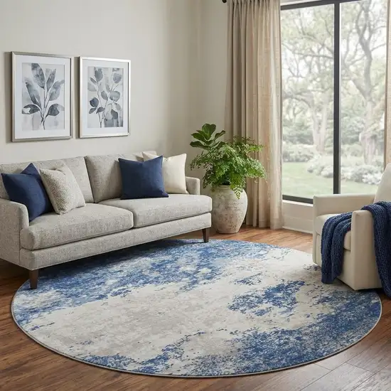 8' Navy Blue And Ivory Abstract Washable Round Rug With UV Protection Photo 1