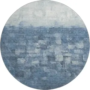 Photo of 8' Navy Blue And Ivory Abstract Washable Round Rug With UV Protection
