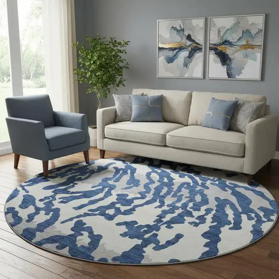 8' Navy Blue And Ivory Animal Print Washable Round Rug With UV Protection Photo 1