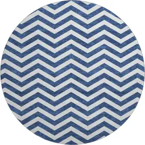 Photo of 8' Navy Blue And Ivory Chevron Washable Round Rug With UV Protection