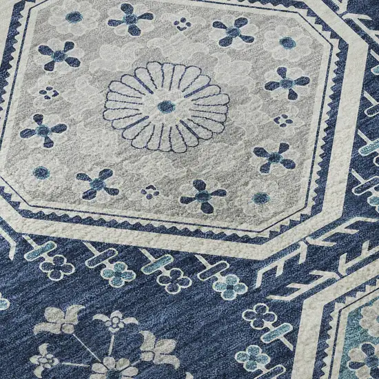 8' Navy Blue And Ivory Floral Washable Area Rug With UV Protection Photo 9