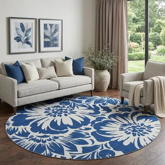 8' Navy Blue And Ivory Floral Washable Round Rug With UV Protection Photo 1