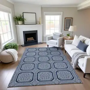 Photo of 8' Navy Blue And Ivory Geometric Washable Area Rug With UV Protection