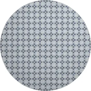 Photo of 8' Navy Blue And Ivory Geometric Washable Round Rug With UV Protection