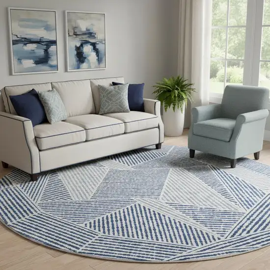 8' Navy Blue And Ivory Geometric Washable Round Rug With UV Protection Photo 1