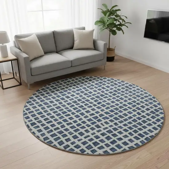 8' Navy Blue And Ivory Geometric Washable Round Rug With UV Protection Photo 2