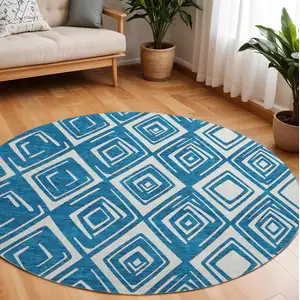 Photo of 8' Navy Blue And Ivory Geometric Washable Round Rug With UV Protection