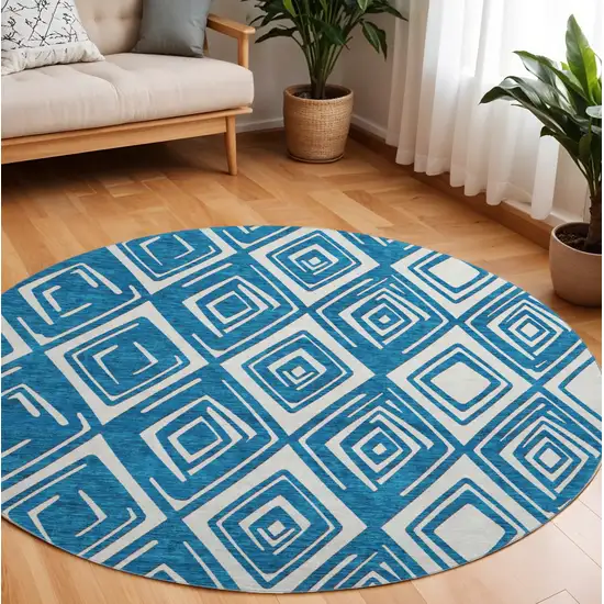 8' Navy Blue And Ivory Geometric Washable Round Rug With UV Protection Photo 1
