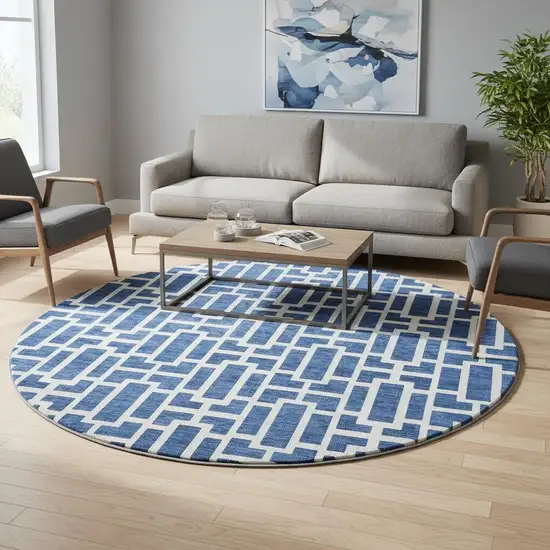 8' Navy Blue And Ivory Geometric Washable Round Rug With UV Protection Photo 2