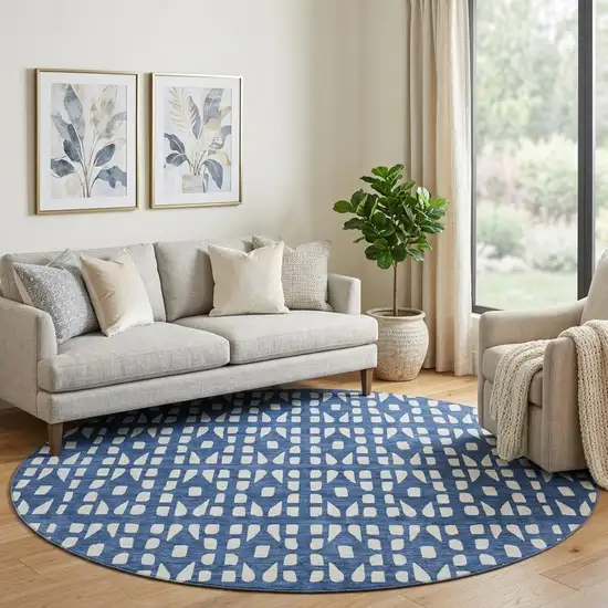 8' Navy Blue And Ivory Geometric Washable Round Rug With UV Protection Photo 1