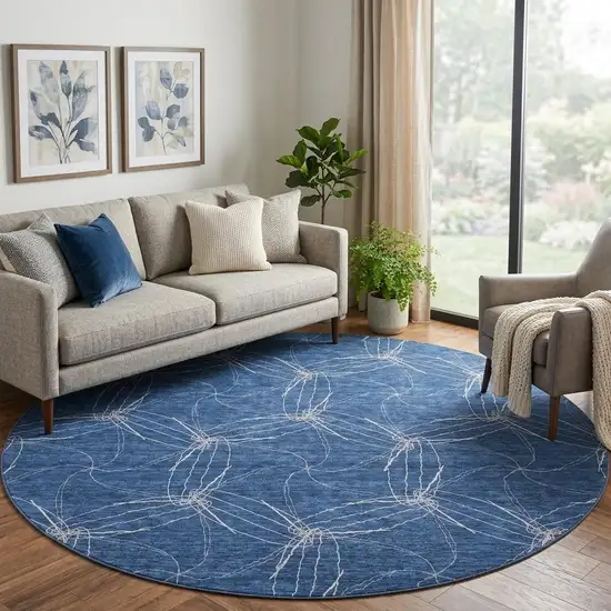8' Navy Blue And Ivory Geometric Washable Round Rug With UV Protection Photo 1
