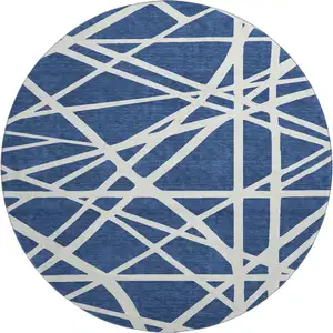 Photo of 8' Navy Blue And Ivory Geometric Washable Round Rug With UV Protection