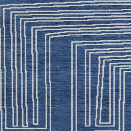 8' Navy Blue And Ivory Geometric Washable Round Rug With UV Protection Photo 3