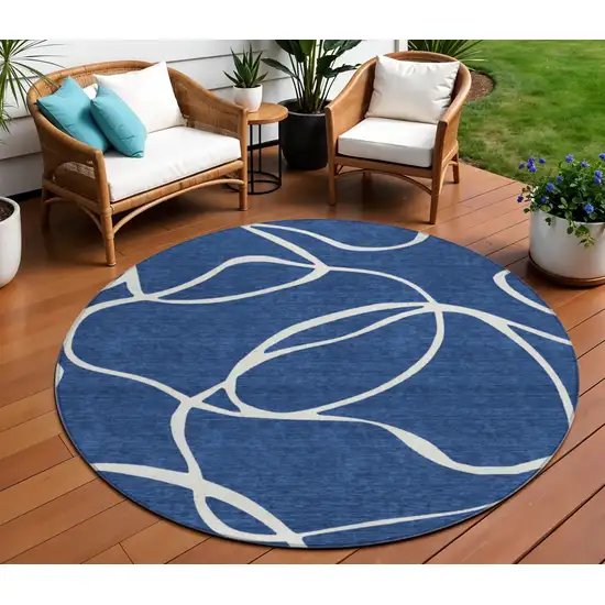 8' Navy Blue And Ivory Round Abstract Washable Indoor Outdoor Area Rug Photo 1