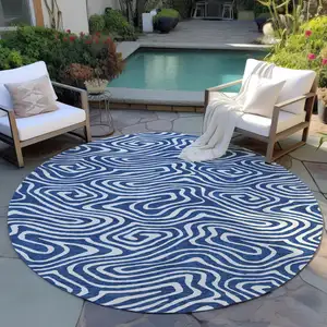 Photo of 8' Navy Blue And Ivory Round Abstract Washable Indoor Outdoor Area Rug