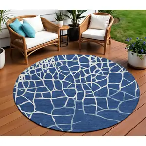 Photo of 8' Navy Blue And Ivory Round Abstract Washable Indoor Outdoor Area Rug