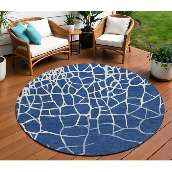 8' Navy Blue And Ivory Round Abstract Washable Indoor Outdoor Area Rug Photo 1