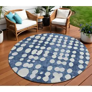 Photo of 8' Navy Blue And Ivory Round Abstract Washable Indoor Outdoor Area Rug
