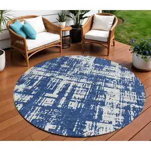 Photo of 8' Navy Blue And Ivory Round Abstract Washable Indoor Outdoor Area Rug