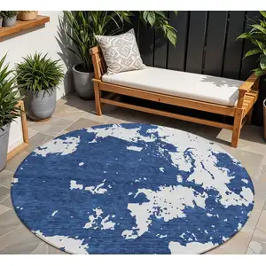 Photo of 8' Navy Blue And Ivory Round Abstract Washable Indoor Outdoor Area Rug