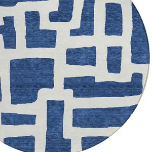Photo of 8' Navy Blue And Ivory Round Abstract Washable Indoor Outdoor Area Rug