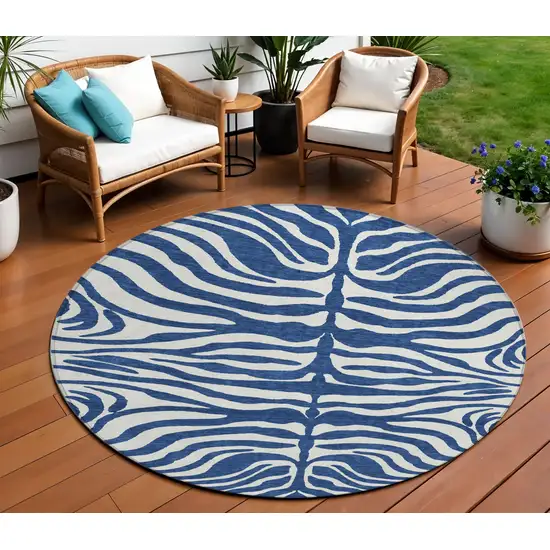 8' Navy Blue And Ivory Round Animal Print Washable Indoor Outdoor Area Rug Photo 1