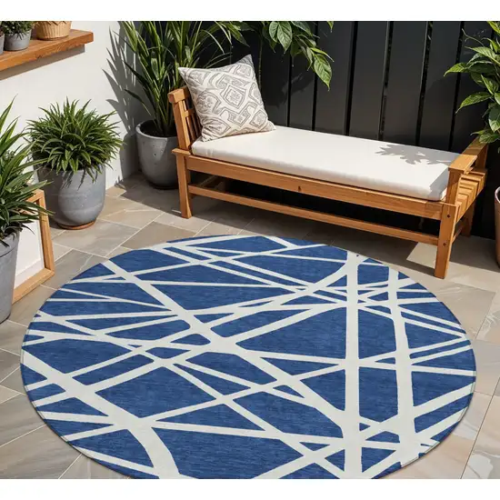 8' Navy Blue And Ivory Round Geometric Washable Indoor Outdoor Area Rug Photo 1