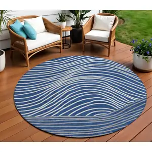 Photo of 8' Navy Blue And Ivory Round Striped Washable Indoor Outdoor Area Rug