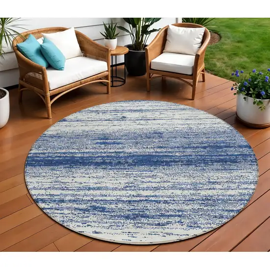 8' Navy Blue And Ivory Round Striped Washable Indoor Outdoor Area Rug Photo 1