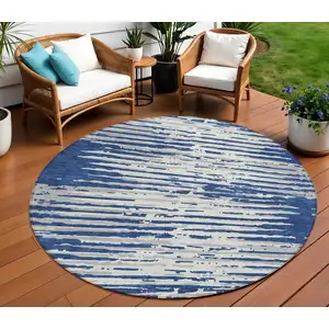 Photo of 8' Navy Blue And Ivory Round Striped Washable Indoor Outdoor Area Rug