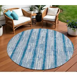 Photo of 8' Navy Blue And Ivory Round Striped Washable Indoor Outdoor Area Rug