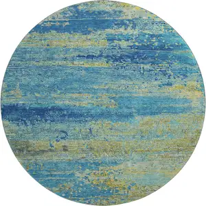 Photo of 8' Navy Blue And Olive Green Abstract Washable Round Rug With UV Protection