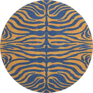 Photo of 8' Navy Blue And Orange Animal Print Washable Round Rug With UV Protection