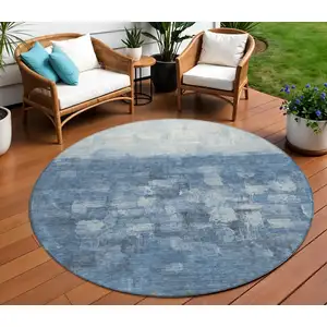 Photo of 8' Navy Blue And Silver Round Abstract Washable Indoor Outdoor Area Rug