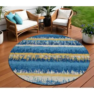 Photo of 8' Navy Blue Gold And Ivory Round Striped Washable Indoor Outdoor Area Rug