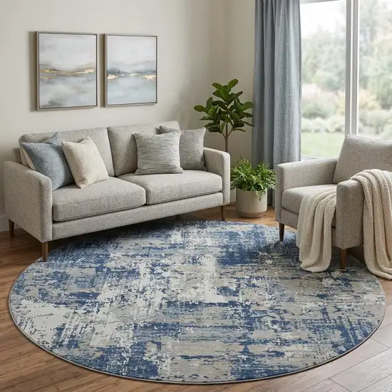8' Navy Blue Gray And Ivory Abstract Washable Round Rug With UV Protection Photo 1
