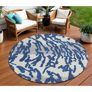 Photo of 8' Navy Blue Gray And Ivory Round Animal Print Washable Indoor Outdoor Area Rug