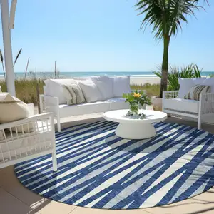 Photo of 8' Navy Blue Gray And Ivory Round Geometric Washable Indoor Outdoor Area Rug