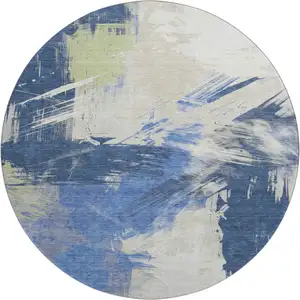 Photo of 8' Navy Blue Green And Ivory Abstract Washable Round Rug With UV Protection
