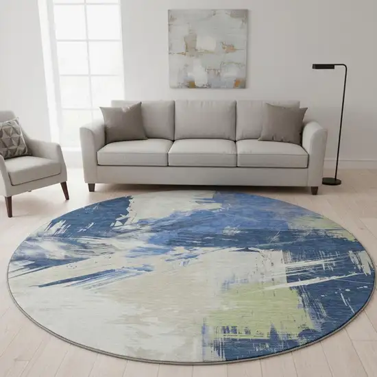 8' Navy Blue Green And Ivory Abstract Washable Round Rug With UV Protection Photo 2