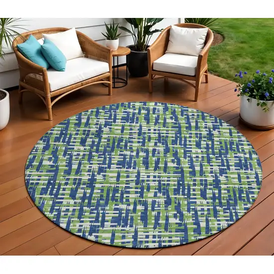 8' Navy Blue Green And Ivory Round Abstract Washable Indoor Outdoor Area Rug Photo 1