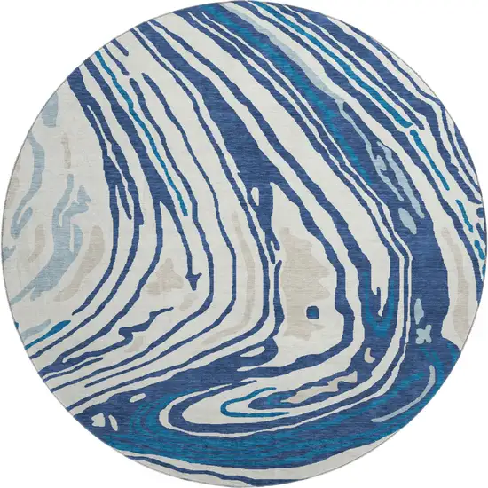 8' Navy Blue Ivory And Beige Abstract Washable Round Rug With UV Protection Photo 1