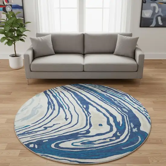 8' Navy Blue Ivory And Beige Abstract Washable Round Rug With UV Protection Photo 2