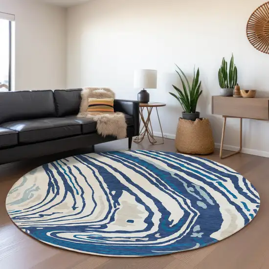 8' Navy Blue Ivory And Beige Abstract Washable Round Rug With UV Protection Photo 3